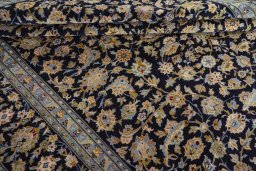 Close-up detail of 2000s Kashan rug from Iran / Persia showing Wool weave