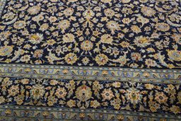 Close-up detail of 2000s Kashan rug from Iran / Persia showing Wool weave