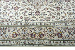 Corner detail of 2000s Kashan rug showing border pattern and Wool pile