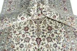 Surface texture of 2000s Kashan rug with natural Wool and intricate pattern
