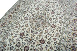 Backside of handmade 2000s Kashan rug showing knot structure and weave density