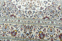 Close-up detail of 2000s Kashan rug from Iran / Persia showing Wool weave