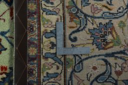 Backside of handmade 2000s Kashan rug showing knot structure and weave density