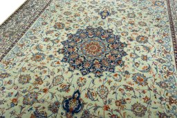 Backside of handmade 2000s Kashan rug showing knot structure and weave density