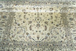 Close-up detail of 2000s Kashan rug from Iran / Persia showing Wool weave