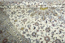 Close-up detail of 2000s Kashan rug from Iran / Persia showing Wool weave