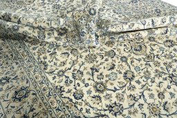 Close-up detail of 2000s Kashan rug from Iran / Persia showing Wool weave