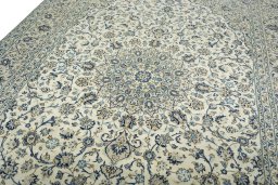 Backside of handmade 2000s Kashan rug showing knot structure and weave density