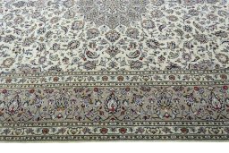 Corner detail of 2000s Kashan rug showing border pattern and Wool pile