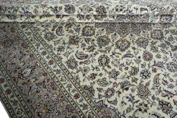 Close-up detail of 2000s Kashan rug from Iran / Persia showing Wool weave