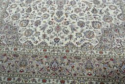 Close-up detail of 2000s Kashan rug from Iran / Persia showing Wool weave