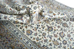 Surface texture of 2000s Kashan rug with natural Wool and intricate pattern