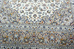 Close-up detail of 2000s Kashan rug from Iran / Persia showing Wool weave