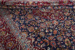 Close-up detail of 2000s Kashan rug from Iran / Persia showing Wool weave