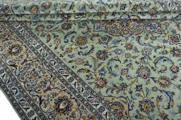 Close-up detail of 2000s Kashan rug from Iran / Persia showing Wool weave