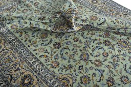 Surface texture of 2000s Kashan rug with natural Wool and intricate pattern