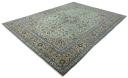 Corner detail of 2000s Kashan rug showing border pattern and Wool pile