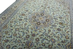 Backside of handmade 2000s Kashan rug showing knot structure and weave density