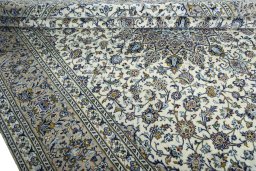 Close-up detail of 2000s Kashan rug from Iran / Persia showing Wool weave