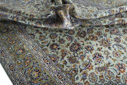 Surface texture of 2000s Kashan rug with natural Wool and intricate pattern