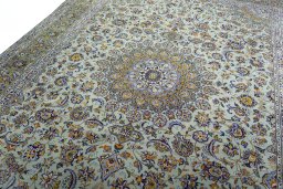 Backside of handmade 2000s Kashan rug showing knot structure and weave density