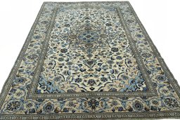 Surface texture of 2000s Kashan rug with natural Wool and intricate pattern