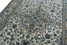 Backside of handmade 2000s Kashan rug showing knot structure and weave density