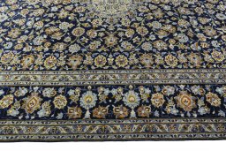 Corner detail of 2000s Kashan rug showing border pattern and Wool pile