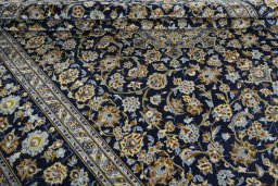 Close-up detail of 2000s Kashan rug from Iran / Persia showing Wool weave