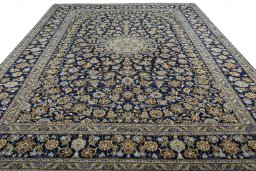 Surface texture of 2000s Kashan rug with natural Wool and intricate pattern