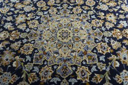 Central medallion detail of 2000s Kashan rug from Iran / Persia