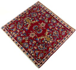 Corner detail of 2000s Kashan rug showing border pattern and Wool pile