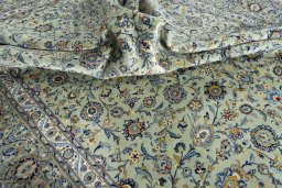 Surface texture of 2000s Kashan rug with natural Wool and intricate pattern