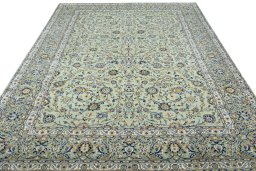 Surface texture of 2000s Kashan rug with natural Wool and intricate pattern