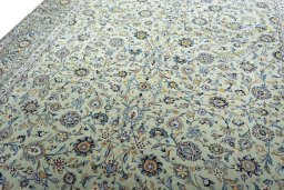 Backside of handmade 2000s Kashan rug showing knot structure and weave density