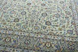 Close-up detail of 2000s Kashan rug from Iran / Persia showing Wool weave