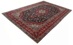 Corner detail of 2000s Kashan rug showing border pattern and Wool pile
