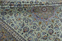 Close-up detail of 2000s Kashan rug from Iran / Persia showing Wool weave