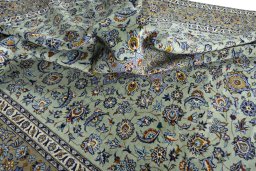 Surface texture of 2000s Kashan rug with natural Wool and intricate pattern