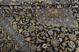 Close-up detail of 2000s Kashan rug from Iran / Persia showing Wool weave