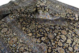 Surface texture of 2000s Kashan rug with natural Wool and intricate pattern