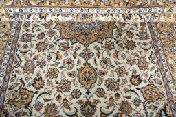 Close-up detail of 2000s Kashan rug from Iran / Persia showing Wool weave