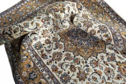 Surface texture of 2000s Kashan rug with natural Wool and intricate pattern