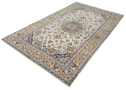 Corner detail of 2000s Kashan rug showing border pattern and Wool pile