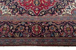 Full view of 2000s Kashan rug from Iran / Persia, 295 × 196 cm in Red tones