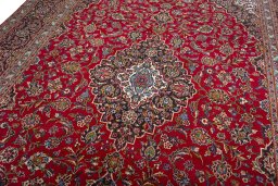 Backside of handmade 2000s Kashan rug showing knot structure and weave density
