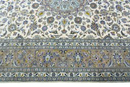 Corner detail of 2000s Kashan rug showing border pattern and Wool pile