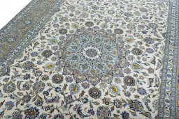 Backside of handmade 2000s Kashan rug showing knot structure and weave density