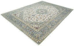 Corner detail of 2000s Kashan rug showing border pattern and Wool pile
