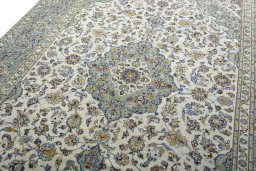 Backside of handmade 2000s Kashan rug showing knot structure and weave density